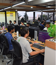 ES infrastructure office with employees working on computers.